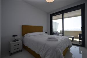 Postel nebo postele na pokoji v ubytování BENIDORM BEACH 2 dormitorios - Fincas Arena + 41 fotografií