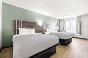 Postel nebo postele na pokoji v ubytování Quality Inn
