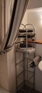 a towel rack in a bathroom with a curtain at Ferienwohnung Bender 2 in Gemünden