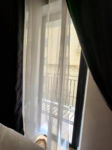 Postel nebo postele na pokoji v ubytování Carlton Hotel