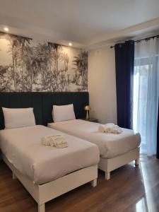 Postel nebo postele na pokoji v ubytování Carlton Hotel