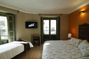 Cama o camas de una habitación en AbraCadabra Suites