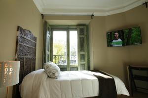 Cama o camas de una habitación en AbraCadabra Suites