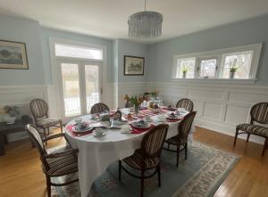 a dining room with a table and chairs at The Boardwalk Inn in Summerside