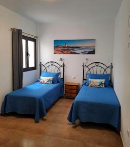 Ένα ή περισσότερα κρεβάτια σε δωμάτιο στο Vv Salitre