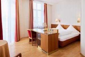 Postel nebo postele na pokoji v ubytování Hotel Zum Schiff