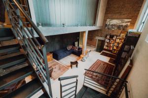 an overhead view of a living room with a staircase at B&B Design in Bologna