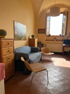 a bedroom with a bed and a dresser at Azienda Agricola Fabbrica Di San Martino in Lucca +37 photos