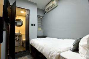 Letto o letti in una camera di Atlas Hostel & Backpackers