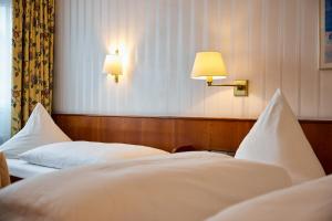 Postel nebo postele na pokoji v ubytování Hotel Zum Schiff
