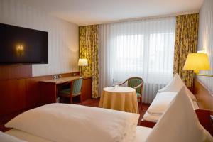 Postel nebo postele na pokoji v ubytování Hotel Zum Schiff