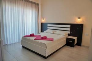 Cama ou camas em um quarto em Marku Palace