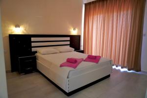 Cama ou camas em um quarto em Marku Palace