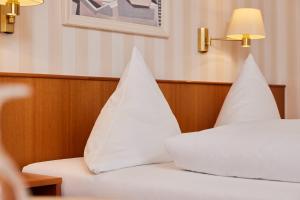 Postel nebo postele na pokoji v ubytování Hotel Zum Schiff