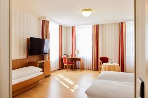 Postel nebo postele na pokoji v ubytování Hotel Zum Schiff