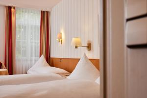 Postel nebo postele na pokoji v ubytování Hotel Zum Schiff