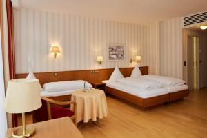 Postel nebo postele na pokoji v ubytování Hotel Zum Schiff