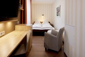 Postel nebo postele na pokoji v ubytování Hotel Zum Schiff