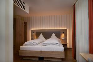 Postel nebo postele na pokoji v ubytování Hotel Zum Schiff