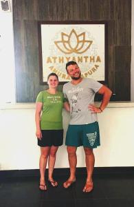 two men are standing in front of a stage at Athyantha Resort in Anuradhapura