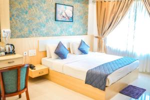 Athirappilly Rainland Resort客房内的一张或多张床位