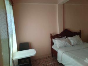 Postel nebo postele na pokoji v ubytování White CastleBeach Resort