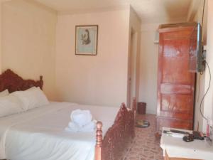 Postel nebo postele na pokoji v ubytování White CastleBeach Resort