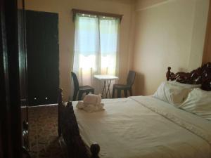 Postel nebo postele na pokoji v ubytování White CastleBeach Resort