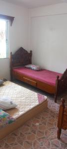 Postel nebo postele na pokoji v ubytování White CastleBeach Resort