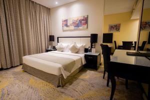 Postel nebo postele na pokoji v ubytování Grand Villaggio Hotel Abu Dhabi