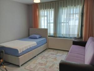 Postel nebo postele na pokoji v ubytování Deniz