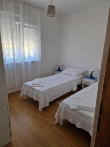 Postel nebo postele na pokoji v ubytování Apartments Jela
