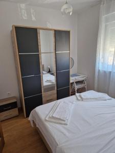Postel nebo postele na pokoji v ubytování Apartments Jela