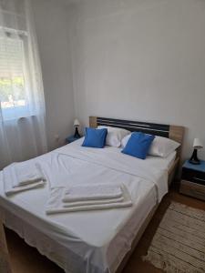 Postel nebo postele na pokoji v ubytování Apartments Jela
