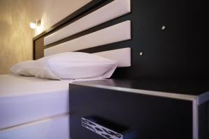 Cama ou camas em um quarto em Marku Palace