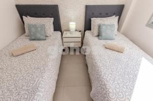 Postel nebo postele na pokoji v ubytování New-exclusive 2-bedroom Apt In Molas Lpez Area