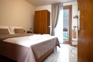 Postel nebo postele na pokoji v ubytování Albergo Trattoria Speranza