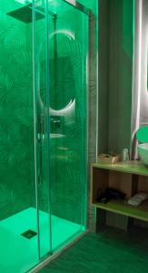 a shower with a glass door in a bathroom at Papavero Giallo B&B in Le Castella +36 photos
