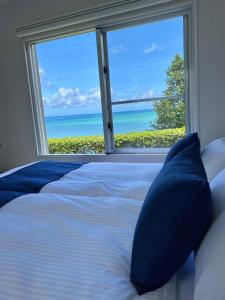 Rúm í herbergi á Villa Yukuru Ishigaki - ビーチ付きヴィラ