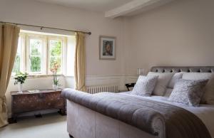 A bed or beds in a room at Norton Grounds 