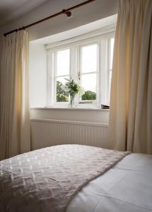 A bed or beds in a room at Norton Grounds 