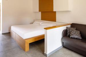 Postel nebo postele na pokoji v ubytování Precise House Montaperti Siena
