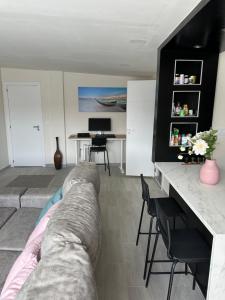 a living room with a couch and a table at New modern apartment, Scandinavian style, ocean view, huge terrace in Icod de los Vinos