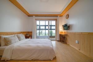 En eller flere senge i et værelse på Le Village Aewol B#2 + 152 billeder