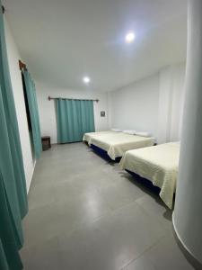 Voodi või voodid majutusasutuse Penguin House toas