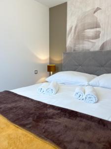 Postel nebo postele na pokoji v ubytování Hotel Lony