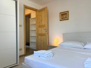 Ένα ή περισσότερα κρεβάτια σε δωμάτιο στο La Dimora dei Pescatori