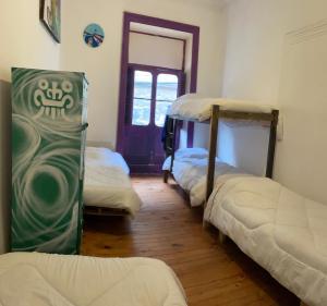 Postel nebo postele na pokoji v ubytování Art Hostel Casa Chaman