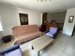 a living room with a couch and a table at Villa Vesna in Veles