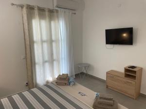 Телевизор и/или развлекательный центр в Deda Apartments